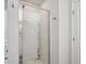 Bright bathroom showcasing a modern glass-enclosed shower with built-in shelving at 531 S Fortune Way, Dallas, GA 30157