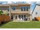 Large backyard with patio offers plenty of space for relaxation and grilling at 6270 Shiloh Woods Dr, Cumming, GA 30040