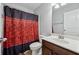 Bathroom featuring a shower and vanity with black and red shower curtain at 6270 Shiloh Woods Dr, Cumming, GA 30040