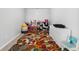 bedroom featuring a colorful rug, a play area and an organization system at 6270 Shiloh Woods Dr, Cumming, GA 30040