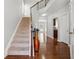 Bright foyer featuring hardwood floors, staircase, and tall ceilings at 6270 Shiloh Woods Dr, Cumming, GA 30040