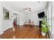 Open concept living room with hardwood floors, fireplace and neutral color palette at 6270 Shiloh Woods Dr, Cumming, GA 30040