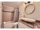 Bathroom featuring a vessel sink, granite countertop, and a shower-tub combo with modern tile at 7155 Roswell Rd # 15, Atlanta, GA 30328