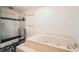 Luxurious bathroom featuring a marble-surround tub and a separate glass-enclosed shower at 7155 Roswell Rd # 15, Atlanta, GA 30328