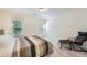 Cozy bedroom with soft carpet, a comfortable bed, and a relaxing chair near the windows at 7155 Roswell Rd # 15, Atlanta, GA 30328