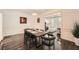 Elegant dining room featuring dark wood floors, wainscoting, and a modern light fixture at 7155 Roswell Rd # 15, Atlanta, GA 30328