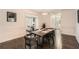 Open-concept dining room with hardwood floors and access to the living room at 7155 Roswell Rd # 15, Atlanta, GA 30328