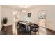 Spacious dining area showcasing hardwood floors and access to the kitchen at 7155 Roswell Rd # 15, Atlanta, GA 30328