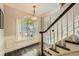 Beautiful entryway featuring a staircase and large window at 7155 Roswell Rd # 15, Atlanta, GA 30328