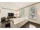 Cozy living room with dark hardwood floors, a large TV, and comfortable seating at 7155 Roswell Rd # 15, Atlanta, GA 30328
