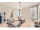 Cozy seating area with natural light showcases neutral walls and chair rail accents at 7155 Roswell Rd # 15, Atlanta, GA 30328