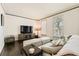 Comfortable living area with hardwood floors, neutral decor, and ample seating space at 7155 Roswell Rd # 15, Atlanta, GA 30328