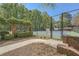 Community tennis courts with green fencing and rules and regulations posted at 7155 Roswell Rd # 15, Atlanta, GA 30328