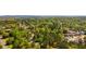 Aerial view showcases a lush, green residential neighborhood with mature trees and well-maintained homes at 1150 Autumn Ridge Dr, Marietta, GA 30066