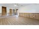 Spacious finished basement with modern flooring, wainscoting, stairs and sliding glass doors at 1150 Autumn Ridge Dr, Marietta, GA 30066