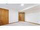 Spacious basement with neutral carpet and three doorways to other rooms or storage areas at 1150 Autumn Ridge Dr, Marietta, GA 30066