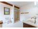 Well-lit bathroom with double sinks, a shower stall, and exposed beams adding character at 1150 Autumn Ridge Dr, Marietta, GA 30066