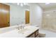 Neutral bathroom featuring an extended countertop, framed mirror, and a standing shower at 1150 Autumn Ridge Dr, Marietta, GA 30066