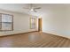 Spacious bedroom features laminate flooring, ceiling fan, and natural light from two windows at 1150 Autumn Ridge Dr, Marietta, GA 30066