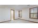 Bedroom has a neutral carpet, natural light from two windows, and a doorway to an adjoining room at 1150 Autumn Ridge Dr, Marietta, GA 30066