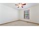 Carpeted bedroom with window with blinds and a modern ceiling fan at 1150 Autumn Ridge Dr, Marietta, GA 30066
