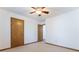Bedroom featuring a ceiling fan, doors, and neutral carpet at 1150 Autumn Ridge Dr, Marietta, GA 30066