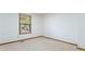This cozy carpeted bedroom features a window letting in natural light at 1150 Autumn Ridge Dr, Marietta, GA 30066