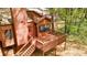 A home's wooden deck with stairs and a partial screened-in porch provides a relaxing outdoor space at 1150 Autumn Ridge Dr, Marietta, GA 30066