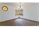 Dining room features hard wood floors, classic chandelier, and a unique octagonal stained glass wall decor at 1150 Autumn Ridge Dr, Marietta, GA 30066