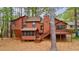 A two-story home with a wood exterior, back deck, screened porch, and landscaped surroundings at 1150 Autumn Ridge Dr, Marietta, GA 30066
