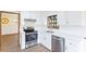 Modern kitchen featuring stainless steel appliances, bright cabinets and backsplash at 1150 Autumn Ridge Dr, Marietta, GA 30066