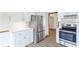 Well-lit kitchen featuring stainless steel appliances, modern cabinets, and hardwood floors at 1150 Autumn Ridge Dr, Marietta, GA 30066