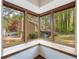 Sun Room features beautiful views of the yard and deck from the corner windows with wood trim at 1150 Autumn Ridge Dr, Marietta, GA 30066