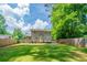 Spacious backyard with wooden fence and large trees at 1171 Bailing Dr, Lawrenceville, GA 30043