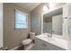 Neutral bathroom featuring a white sink vanity and a large mirror at 1171 Bailing Dr, Lawrenceville, GA 30043