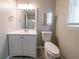 Well-lit bathroom featuring a vanity with storage and a large mirror at 1171 Bailing Dr, Lawrenceville, GA 30043