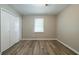 Bedroom with a large closet, a window and light gray walls at 1171 Bailing Dr, Lawrenceville, GA 30043