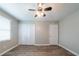 Bedroom featuring hardwood floors and a double closet door at 1171 Bailing Dr, Lawrenceville, GA 30043