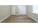 Bedroom featuring hardwood floors and a double closet door at 1171 Bailing Dr, Lawrenceville, GA 30043
