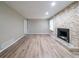 Cozy living room with stone fireplace and new flooring at 1171 Bailing Dr, Lawrenceville, GA 30043