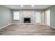 A living room with modern flooring and a striking fireplace feature at 1171 Bailing Dr, Lawrenceville, GA 30043