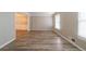 An empty living room featuring fresh paint, flooring, and a window at 1171 Bailing Dr, Lawrenceville, GA 30043