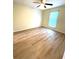 This bedroom has a window, ceiling fan and hardwood flooring at 2805 Ne Ne Expressway Ne # B-26, Atlanta, GA 30345