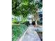 Landscaped yard with mature trees, green shrubs, and a walkway leading to the house at 2805 Ne Ne Expressway Ne # B-26, Atlanta, GA 30345