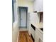 This kitchen has a refrigerator, white cabinets and wood flooring at 2805 Ne Ne Expressway Ne # B-26, Atlanta, GA 30345
