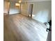 Open living room features neutral paint and updated flooring at 2805 Ne Ne Expressway Ne # B-26, Atlanta, GA 30345