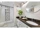Stylish bathroom featuring granite countertops, a tiled shower with built-in shelves, and modern fixtures at 2898 Stockbridge Way, Dacula, GA 30019