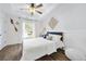 Inviting bedroom with natural light, luxury vinyl plank flooring, and classic white trim at 2898 Stockbridge Way, Dacula, GA 30019