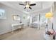 Serene bedroom with canopy bed, tray ceiling, neutral colors, and natural light at 2898 Stockbridge Way, Dacula, GA 30019