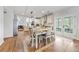 Bright dining area with a table, stylish chairs, and double doors to backyard at 2898 Stockbridge Way, Dacula, GA 30019